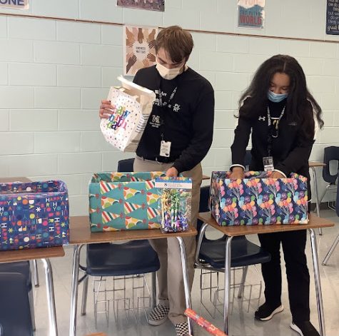 Service Club members collect materials to be donated to students and seniors in need.