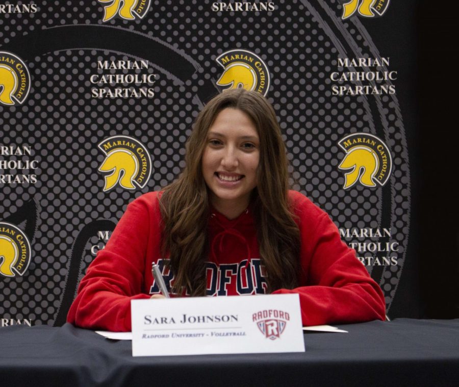 Senior+Sara+Johnson+signs+her+letter+of+intent+to+play+for+Radford+University+next+year.