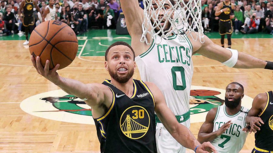 Jun 10, 2022; Boston, Massachusetts, USA; Golden State Warriors guard Stephen Curry (30) attempts a layup against Boston Celtics forward Jayson Tatum (0) during the first half of game four in the 2022 NBA Finals at the TD Garden. Mandatory Credit: Kyle Terada-USA TODAY Sports